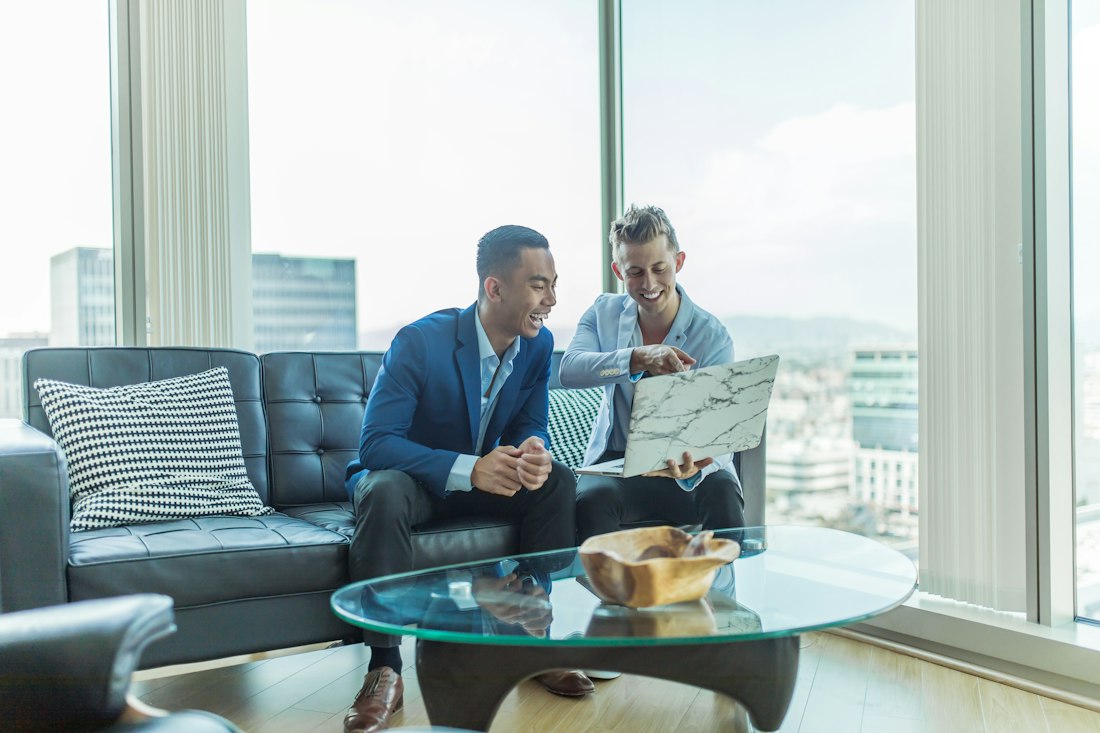 Financial advisors meeting with a client